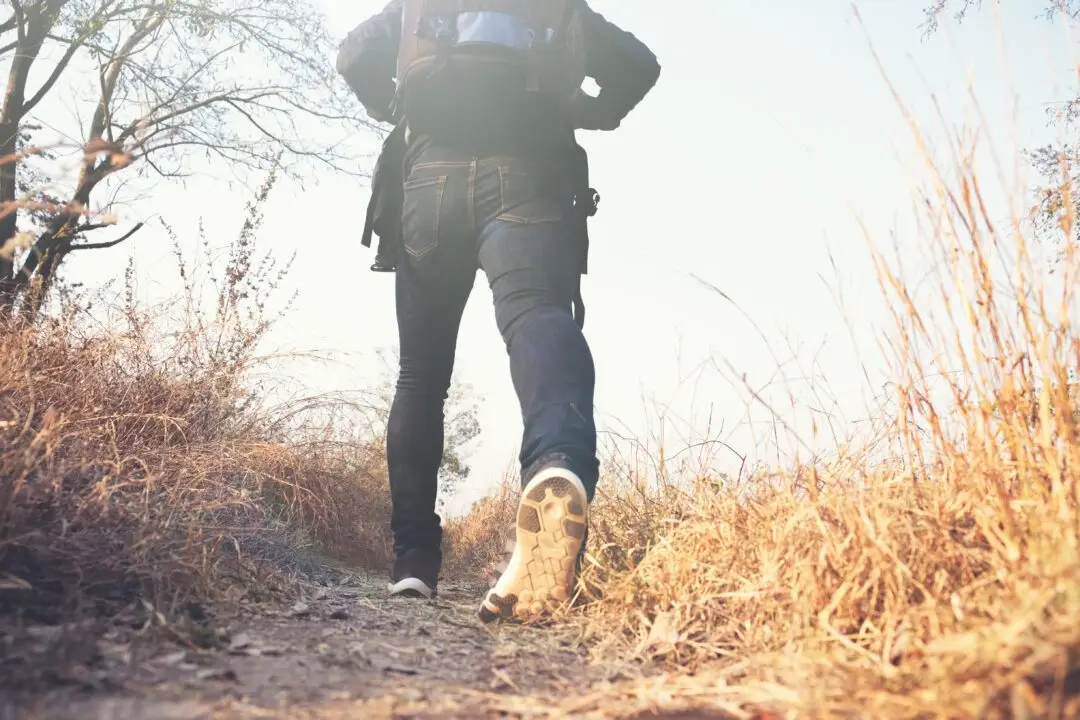 young man traveler with backpack relaxing outdoor.