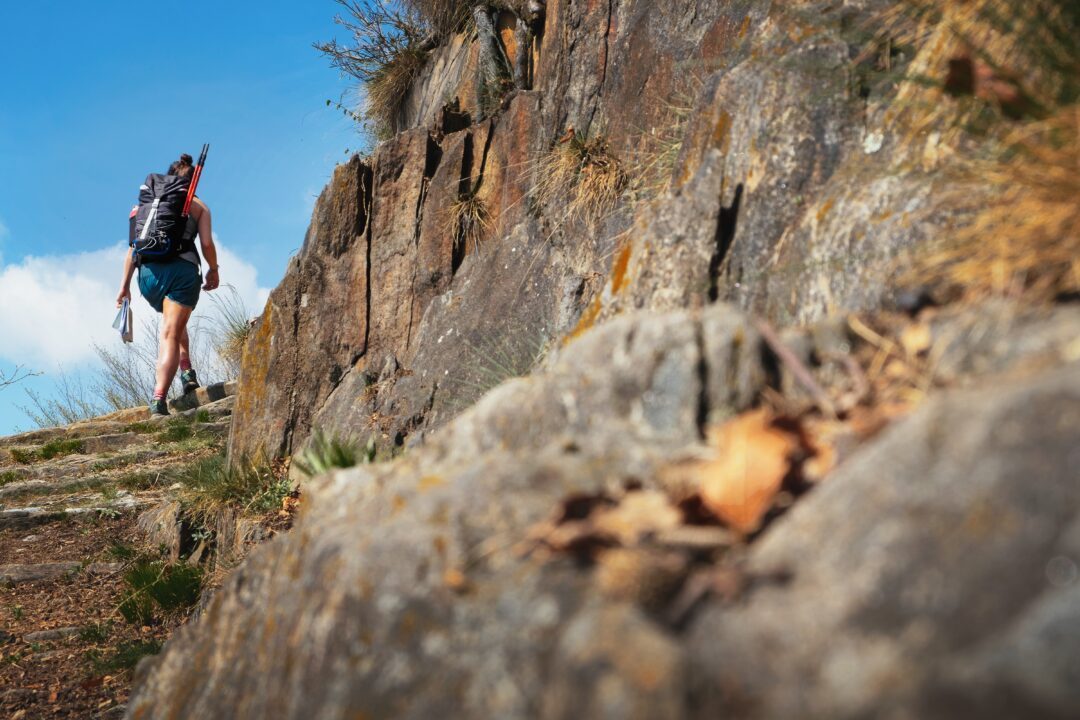 young woman hiking in the mountains in piedmont, italy